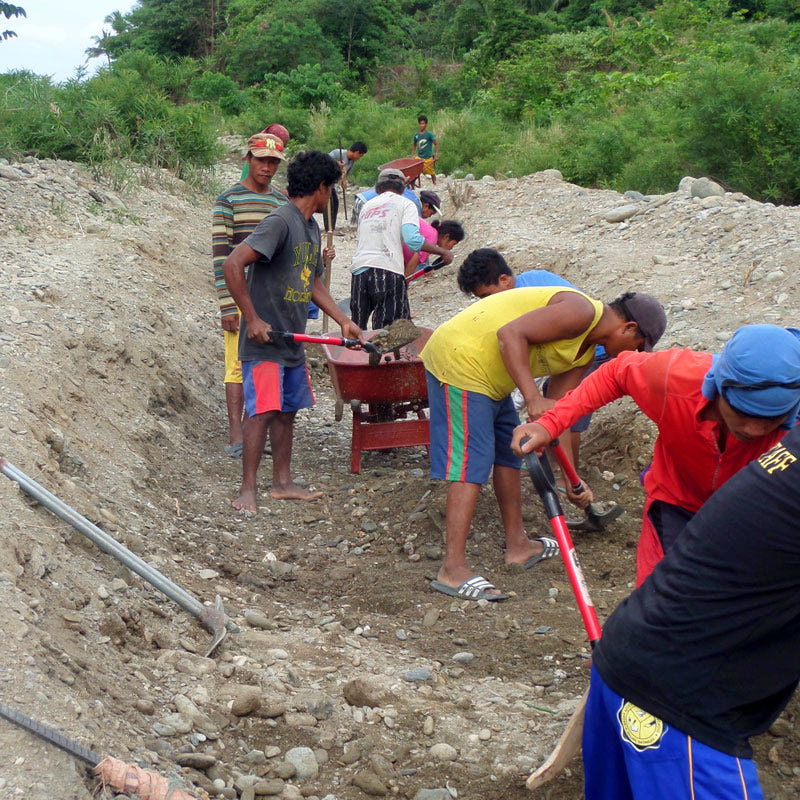 Working in the riverbank with manual tools